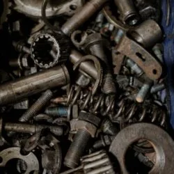 A detailed close-up of various metal gears and spare parts, perfect for industrial themes.